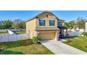 Well-maintained two-story home with an attached garage and a beautifully landscaped front yard at 4010 Lindever Ln, Palmetto, FL 34221