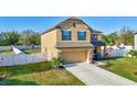 Attractive two-story home with a two-car garage and meticulously maintained lawn in a suburban neighborhood at 4010 Lindever Ln, Palmetto, FL 34221
