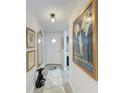 Entryway with decor and door, leading to open floor plan at 4186 Heron Way # B-219, Bradenton, FL 34205