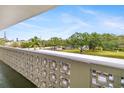 Condo balcony view with green landscape and a few neighborhood houses at 4885 1St Ne St # 308, St Petersburg, FL 33703