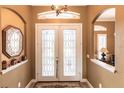 Elegant glass double front door with decorative sidelights at 5391 90Th Avenue E Cir, Parrish, FL 34219