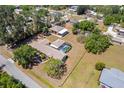 Aerial view of estate with pool, manicured grounds, and detached garage with covered parking at 6217 Goldfinch St, Sarasota, FL 34241