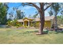 Charming single story home with manicured lawn and lush tropical landscaping at 6217 Goldfinch St, Sarasota, FL 34241