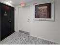 Hallway showing the door and artwork with a fire dept. valve at 707 S Gulfstream Ave # 501, Sarasota, FL 34236