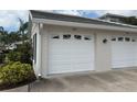 Garage door with contemporary window details and the address number 202 at 902 Addington Ct # 202, Venice, FL 34293