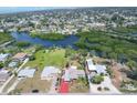 Expansive aerial view of the property showcasing its waterfront location and community at 1156 Lemon Bay Dr, Venice, FL 34293