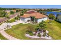 Sprawling corner lot home with mature landscaping and a view of the neighborhood lake at 12830 24Th Street E Cir, Parrish, FL 34219
