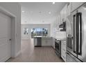 Spacious kitchen with white cabinets, stainless steel appliances, and a large window at 1617 Sea Haven Dr # 501, Punta Gorda, FL 33950