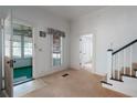 Bright room featuring carpet and views to the enclosed porch at 1704 4Th W St, Palmetto, FL 34221