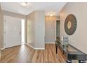 Welcoming foyer featuring wood-look tile, stylish decor, and a bright, airy atmosphere at 1712 Starling Dr # 101, Sarasota, FL 34231