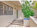 Inviting front entrance with a decorative plant, steps, and brick entryway to welcome you home at 1712 Starling Dr # 101, Sarasota, FL 34231