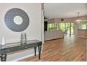 Open-concept living room with wood-look tile flooring and neutral tones for a modern aesthetic at 1712 Starling Dr # 101, Sarasota, FL 34231