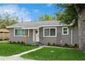 Inviting single-story home with well-maintained lawn and landscaped garden beds at 1813 5Th W St, Palmetto, FL 34221