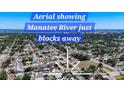Expansive aerial view of neighborhood near the Manatee River showing the proximity of the water and community at 2705 21St W Ave, Bradenton, FL 34205
