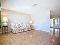 Bright living room with tile flooring and large windows offering plenty of natural light at 2705 21St W Ave, Bradenton, FL 34205