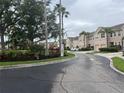 Scenic street view of this community with mature trees and landscaping at 3938 Yellowstone Cir, Sarasota, FL 34233