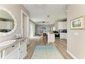 Open-concept living space showcasing a kitchen with an island and a comfortable living area at 412 73Rd St, Holmes Beach, FL 34217