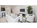 Comfortable living room with a cozy seating arrangement and open floor plan at 4781 Vignette Way, Sarasota, FL 34240