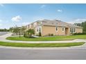 Lovely home showcases pristine lawn care, a neutral exterior, and a sidewalk at 5520 Coachwood Cv, Bradenton, FL 34211