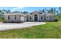 Beautiful single story home featuring a spacious lawn, large driveway, and an attached two car garage at 6407 213Th E St, Bradenton, FL 34211