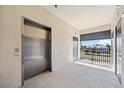 Hallway to unit features elevator access and beautiful views at 1020 Tidewater Shores Loop # 304, Bradenton, FL 34208