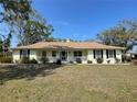 Charming single-story home with a front porch, manicured lawn, and lovely curb appeal at 12809 7Th Ne Ave, Bradenton, FL 34212