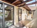Comfortable screened in porch leading to the residence's sliding glass doors at 1421 57Th W St # 1421, Bradenton, FL 34209
