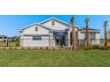 Beautiful single-story home with a well-manicured lawn and decorative stone accents at 17134 James Trl, Parrish, FL 34219