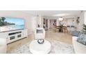 Inviting living space with an open concept to the dining area and kitchen with beach views at 1750 Benjamin Franklin Dr # 6B, Sarasota, FL 34236