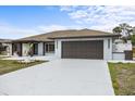Charming single-story home with a freshly painted exterior and attached two-car garage at 2881 48Th E Way, Bradenton, FL 34203