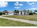 Charming single-story home boasts a well-maintained lawn and a two-car garage, enhancing its curb appeal at 4033 Dover E Dr, Bradenton, FL 34203