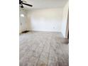 Bright living room featuring tiled floors, a ceiling fan, and ample natural light at 4058 Gatewood Dr, Sarasota, FL 34232