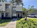 Charming condo featuring a neatly maintained lawn and inviting walkway leading to the front door at 4923 25Th W St # 104, Bradenton, FL 34207