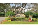 Beautiful community entrance with lush landscaping at 5242 Manorwood Dr Dr # 3A, Sarasota, FL 34235
