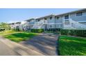 Exterior view of condos with private parking and well-manicured lawn at 6033 34Th W St # 132, Bradenton, FL 34210