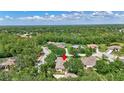 An aerial view of the home surrounded by lush greenery and other residential properties at 14104 E 22Nd Ter, Bradenton, FL 34212
