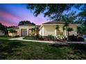 Charming home featuring manicured landscaping, a walkway, and a stylish blue front door at 14104 E 22Nd Ter, Bradenton, FL 34212