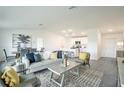 Open-concept living room featuring modern decor and an adjacent dining area at 1492 Truval Ter, Port Charlotte, FL 33952