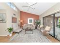 Bright living room featuring vaulted ceiling, natural light, and access to screened lanai at 1532 Pelican Point Dr # 240, Sarasota, FL 34231
