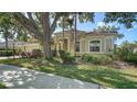 Beautiful one-story home with well-maintained landscaping, a tile roof, and lush greenery, providing a welcoming curb appeal at 241 Willow Bend Way, Osprey, FL 34229