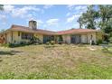 Spacious backyard with mature trees, offering plenty of room for outdoor activities and relaxation at 2417 6Th Avenue E Dr, Bradenton, FL 34208