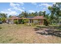 Lovely single-story home with solar panels, featuring a well-maintained yard at 2417 6Th Avenue E Dr, Bradenton, FL 34208