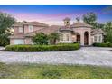 Attractive property with a paved driveway, manicured hedges, and a well-maintained lawn at 3905 Trentwood Pl, Sarasota, FL 34243