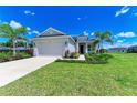Beautiful single-story home with well-manicured lawn and decorative landscaping at 4324 Sea Marsh Pl, Parrish, FL 34219