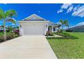 Lovely single-story home featuring an attached two-car garage and verdant lawn at 4324 Sea Marsh Pl, Parrish, FL 34219