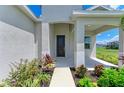 Inviting front entrance with manicured landscaping and covered porch at 4324 Sea Marsh Pl, Parrish, FL 34219