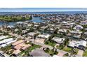 Expansive aerial view of a waterfront community, showcasing canals, homes, and ocean views at 519 74Th St, Holmes Beach, FL 34217