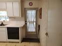 A kitchen featuring modern appliances and ample counter space with a door to outside at 5536 Denmark Dr, Bradenton, FL 34207