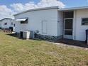 This single story home shows off its simple design with a small awning and room for a garden at 5536 Denmark Dr, Bradenton, FL 34207