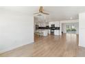 Open concept kitchen boasts stainless steel appliances, a center island, and modern white cabinetry at 609 Glen Oak Rd, Venice, FL 34293